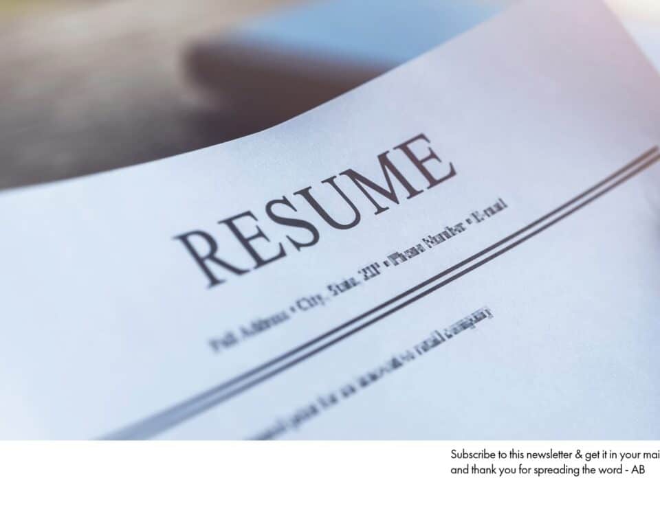 Close-up of a person holding a resume. Your resume is a signaling device; make sure you're sending the right signals with a well-crafted document.