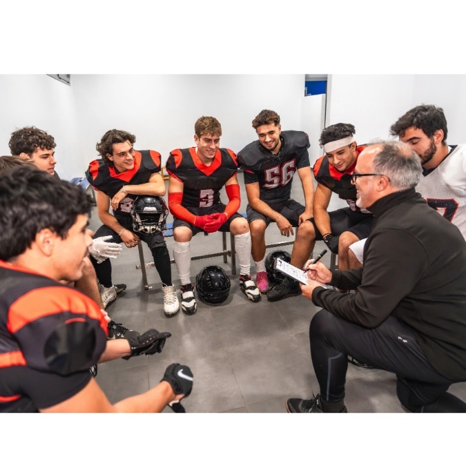 Coach shares insights with his football team, showing how Skill Distance Bends Power and influences Behavior Everywhere on the field.