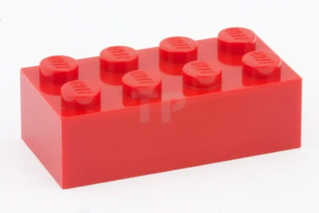 A bright red LEGO brick, perfect for sparking creativity in children. Why do children play? It's all about imagination!
