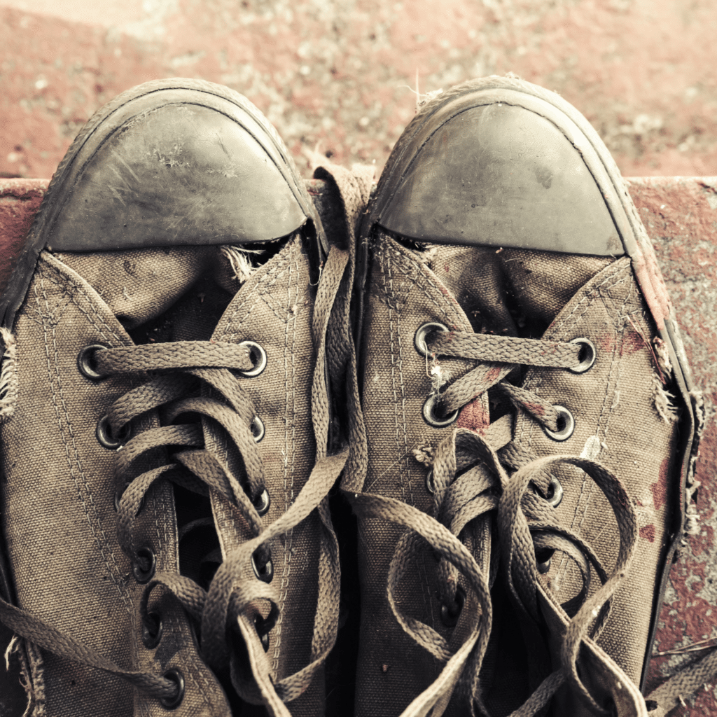 Worn-out sneakers symbolize the joy of play, reminding us why do children play and explore their world.