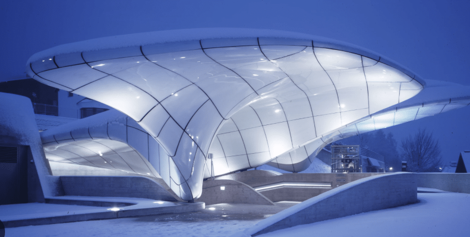 A stunning view of Zaha Hadid's architectural masterpiece, showcasing the Hunar of Zaha Hadid in a snowy setting.