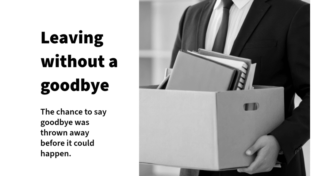 A person in a suit holding a cardboard box filled with office items, illustrating the feeling of Ambiguous Loss: The AI-Era Grief With No Name.